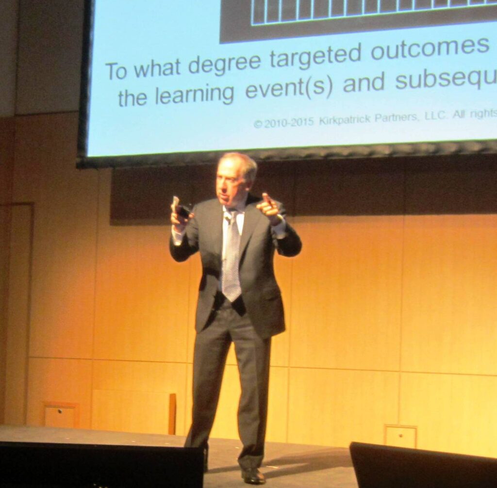 Dr. Jim Kirkpatrick speaking at a conference